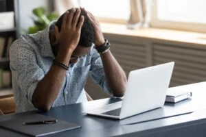 upset black man at computer