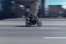 man speeding on motorcycle