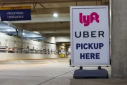 lyft and uber sign in a garage