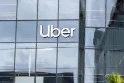 uber sign on glass headquarters building