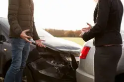 Two people arguing after a crash. They can contact an Enfield car accident lawyer for help.