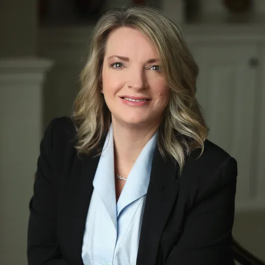 Dana Fowler portrait: Professional headshot of Dana Fowler, attorney at DeMayo Law, smiling in front of a plain backdrop.