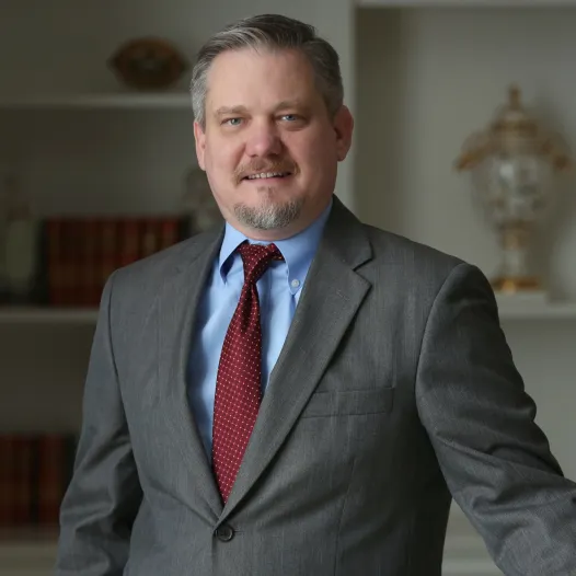 David Blackwell portrait: Professional headshot of David Blackwell, attorney at DeMayo Law, standing against a plain background.