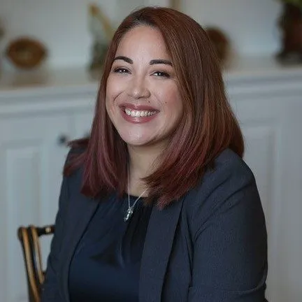 Iraida Villanueva portrait: Professional headshot of Iraida Villanueva, attorney at DeMayo Law, with a neutral background.