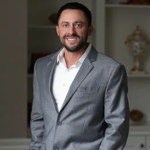 Nick Idol portrait: Professional headshot of Nick Idol, attorney at DeMayo Law, posed against a neutral background.