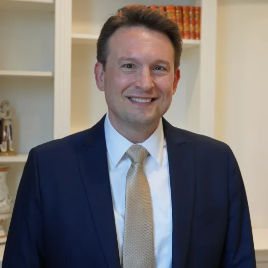 Philip Gray portrait: Professional headshot of Philip Gray, attorney at DeMayo Law, posed against a neutral background.