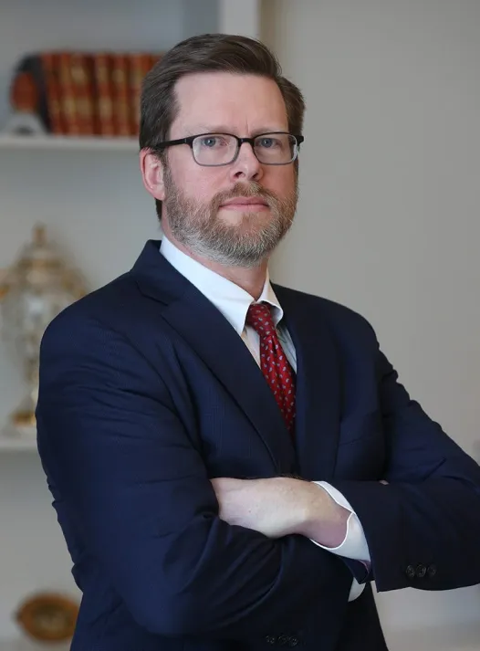 Reed Hunt portrait: Professional headshot of Reed Hunt, attorney at DeMayo Law, posed against a neutral background.