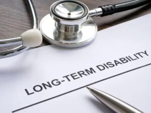 A stethoscope and a pen lie on top of paperwork saying “Long-Term Disability,” while a person off-camera wonders: Does ERISA contain a statute of limitations?