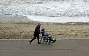 Disabled woman on vacation at beach