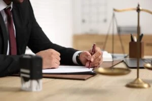 What Does a Disability Lawyer Do lawyer signing contract