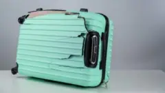 Broken Suitcase Lying on Its Side