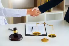 tallahassee drunk driving accident attorney shakes client hand