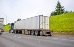 Broken semi-truck with loaded container. How is fault determined in a truck crash?