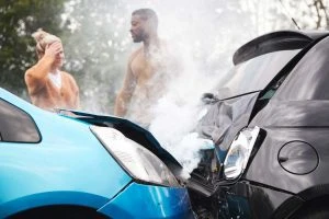 two drivers discussing details of a rear-end car accident