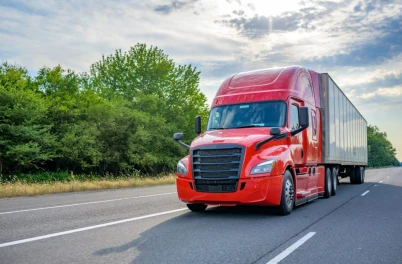 large red truck going down the highway in rhode island