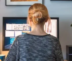 woman works from her desk at home