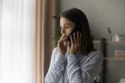 stressed woman calling to report a car accident