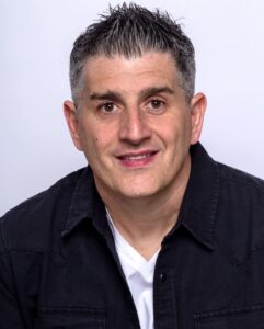 Headshot of Jason Hennessey looking at camera