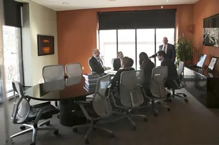 Meyer Wilson Attorneys meeting in board room | Investment Fraud Lawyers | Investor Claims
