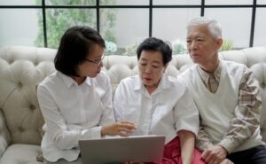 An investment fraud lawyer in Pittsburgh speaking with an elderly couple.