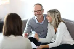 a mature couple consulting with a Louisiana excessive trading lawyer