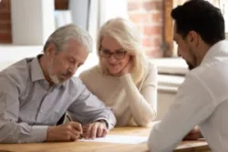 Lawyer meets with two clients who lost money on exchange traded notes.