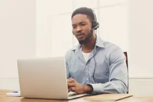 black insurance agent on a headset taking a call