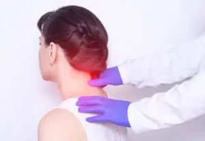 neurologist examining a woman’s neck