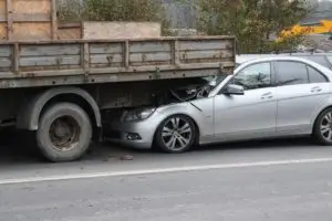 truck crushing a passenger car