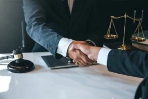 lawyer shaking hands with client