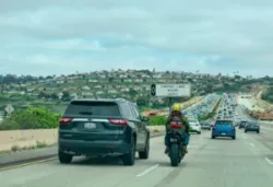 motorcyclist looking to lane-split