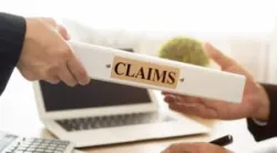 people handling a claims folder