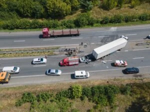 An aerial view of a truck accident. How much does a truck accident lawyer cost?