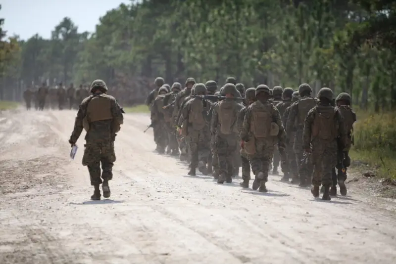 Troops walk near camp lejeune base. Learn more about how filing a lawsuit for water contamination can affect your veterans disability benefits.
