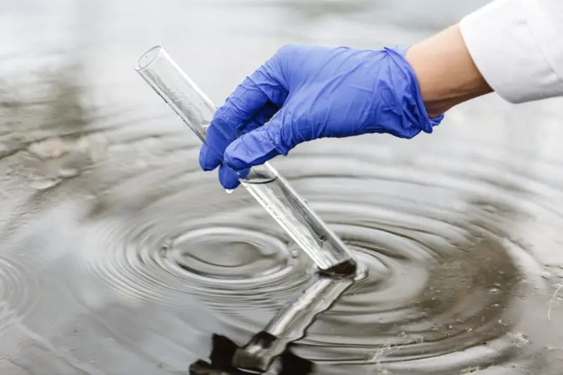 scientist tests water at camp lejeune base