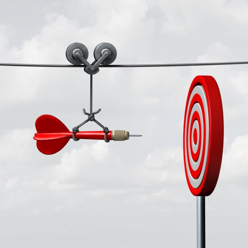 Image of a dart guided by a pulley system towards a target. Symbolizes the chances of winning a wrongful death suit.