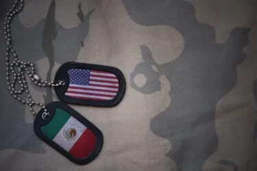 Army dog tag with USA and Mexico flags. What Is Parole in Place?