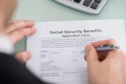man-filling-out-SSD-benefits-form