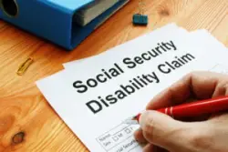 Man fills out Social Security Disability claim.