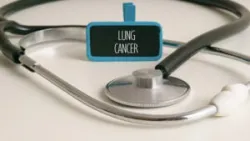 A stethoscope on a white table next to the words "Lung Cancer," symbolizing the medical basis for a Social Security Disability claim related to lung cancer.