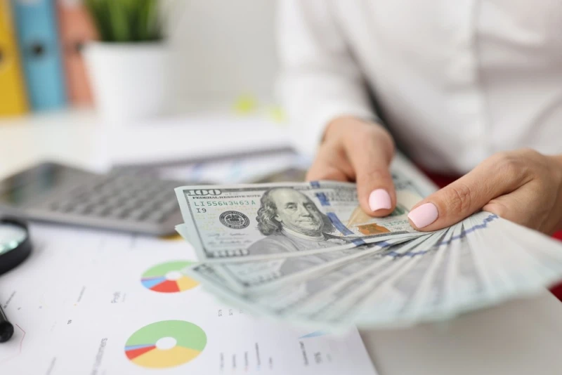 Man holding Legal Funding money
