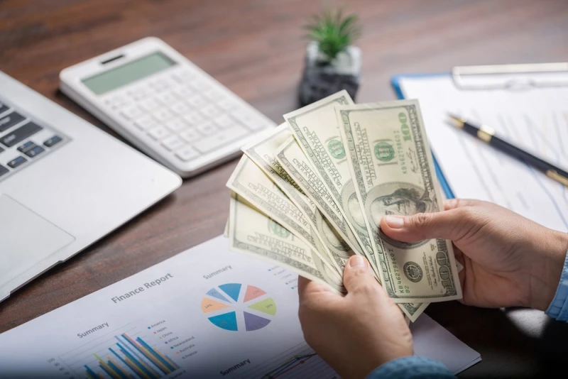 Woman counting Legal Funding money