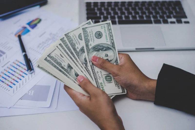 Woman counting Legal Funding money