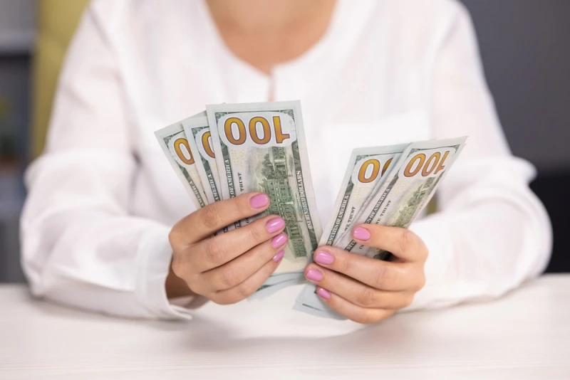 Woman counting Lawsuit Loan cash