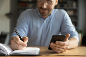 man doing research on his phone