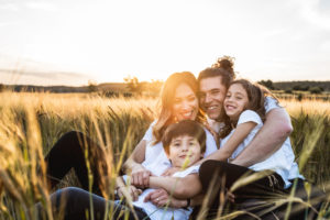 a happy family having fun in the countryside