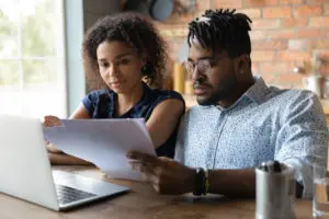 black couple reviewing loan documents