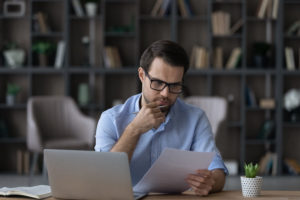 man-contemplating-his-financials