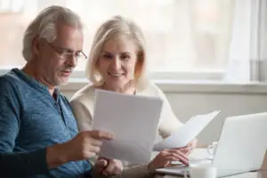 older-couple-reviewing-loan-paperwork