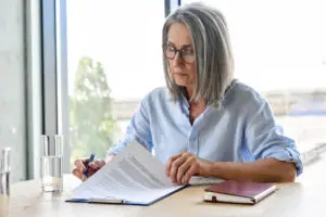 woman looking over her loan paperwork